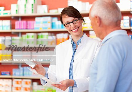 Pharmacist talking to patient in store