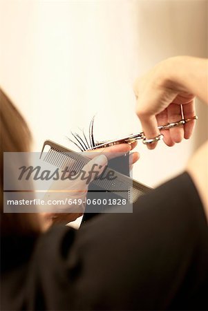 Hair stylist cutting clients hair