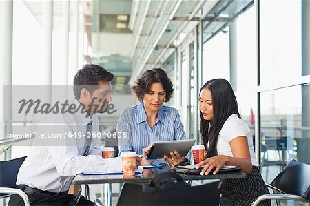 Business people working together in cafe