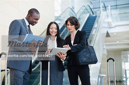 Business people talking in lobby