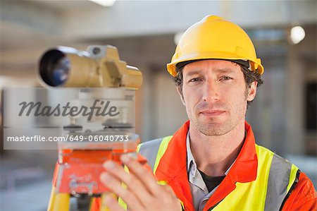 Worker using equipment on site