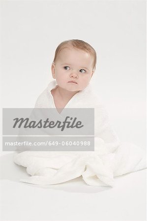 Close up of baby girl wearing bathrobe