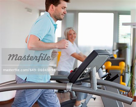 Man using treadmill in gym