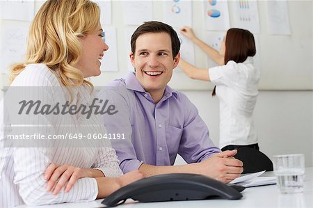 Business people laughing in office