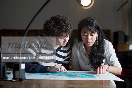 Students reading map in class