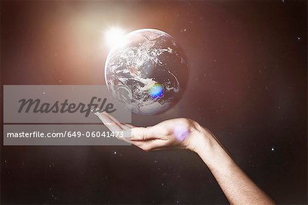 Hand holding image of the Earth