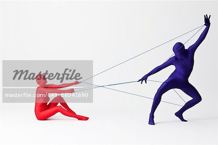 Couple in bodysuits playing with string