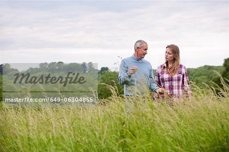 Father and daughter in tall grass