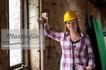 Construction worker smiling on site