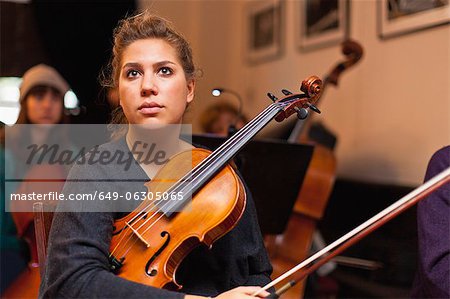 Violin player sitting in practice