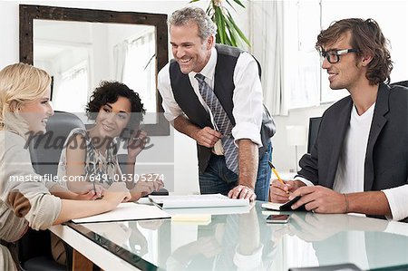 Business people working together at desk Business people working together at desk