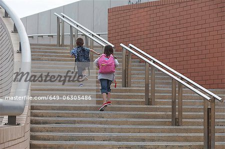 Children climbing stairs outdoors