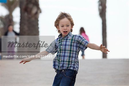 Boy riding skateboard outdoors