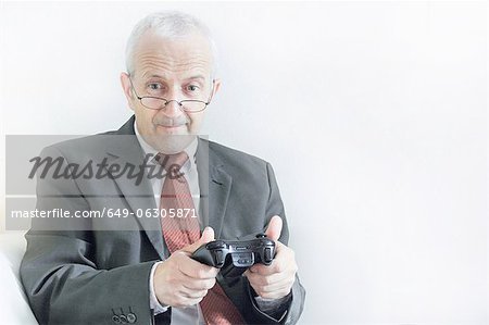 Businessman playing video games