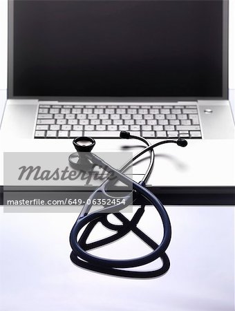 Close up of stethoscope on laptop