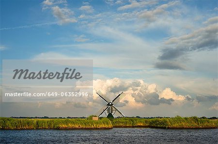 Windmill in rural landscape