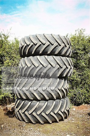 Tires stacked together in garden