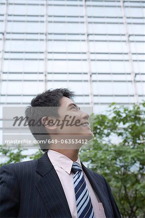 Businessman standing on city street