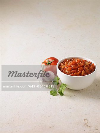 Bowl of salsa with tomato and garlic