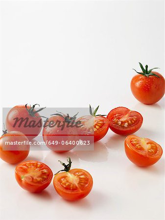 Halved plum tomatoes on kitchen counter