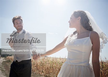 Newlywed couple walking outdoors