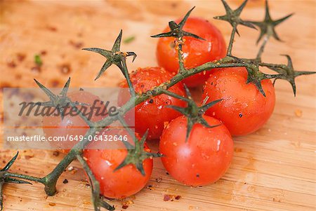 Cherry tomatoes on vine with spices