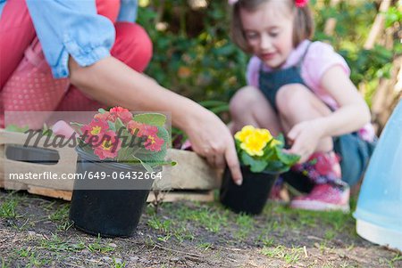 Mother and daughter gardening together