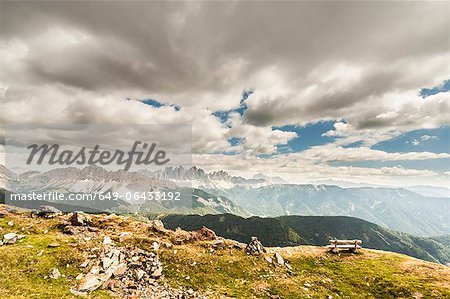 Clouds over grassy rural landscape