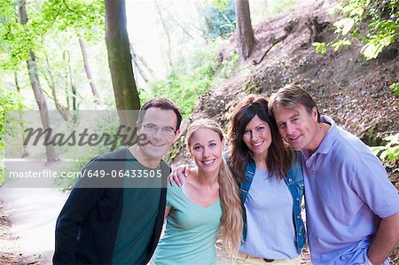Couples smiling together in forest