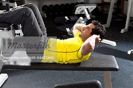 Man using exercise equipment at gym