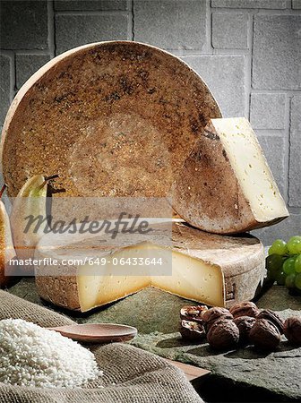 Cheese, fruit and grains on table