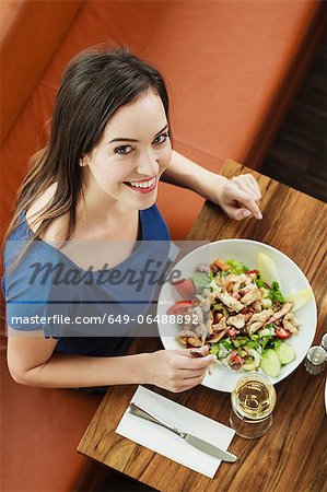 Woman having lunch at cafe
