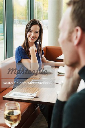 People admiring each other in cafe