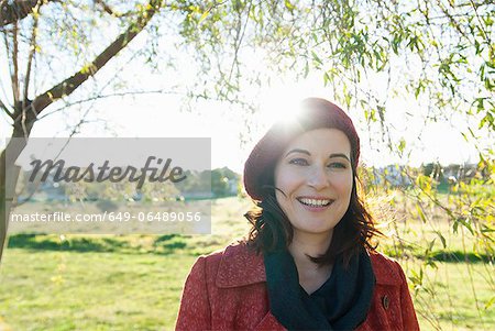 Smiling woman walking in field