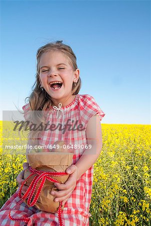Girl holding sack of apples outdoors Girl holding sack of apples outdoors