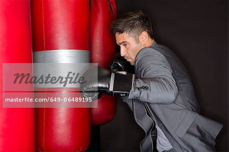 Boxer training with punching bag