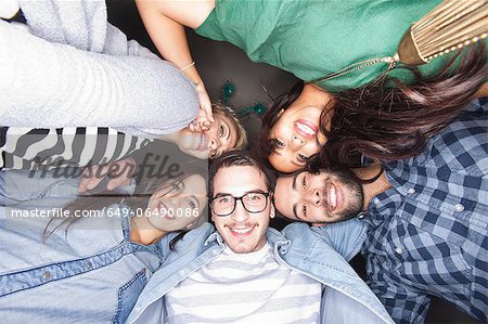 Friends smiling together in circle