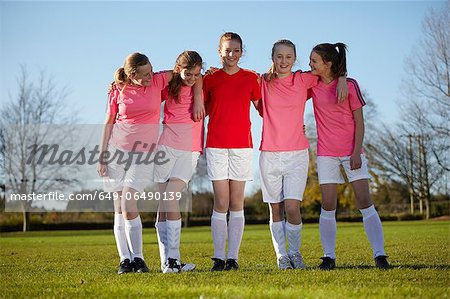 Football team walking together in field