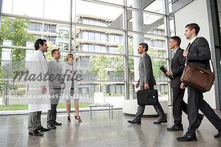 Doctors and businessmen meeting