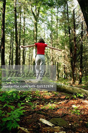 Woman walking in forest