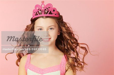 Smiling girl wearing pink tiara