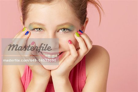 Smiling girl wearing colorful makeup