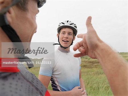 Father and son talking on rural road