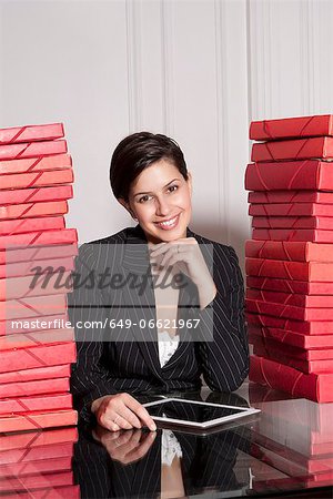 Businesswoman with stacks of folders