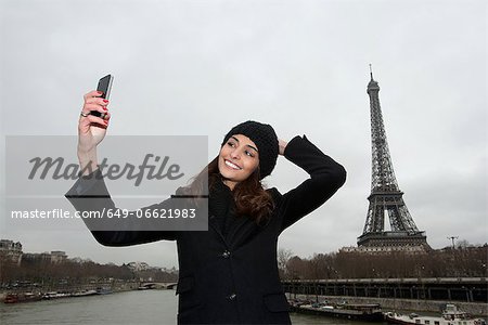 Woman taking picture with cell phone