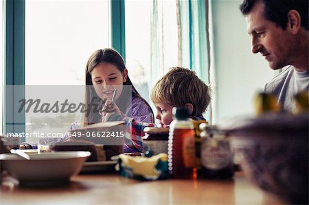 Family eating together at table