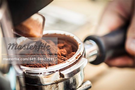Close up of espresso grounds in machine