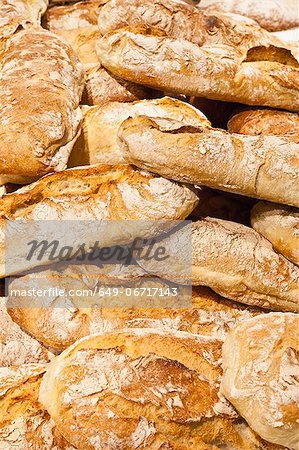 Pile of crusty bread loaves Pile of crusty bread loaves