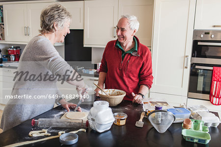Senior couple preparing pastry
