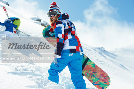 Female snowboarder in snow